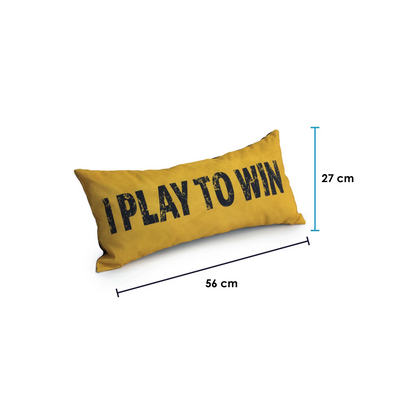 A rectangular pillow with the words "I PLAY TO WIN" and the dimensions "27 cm x 56 cm" printed on it.