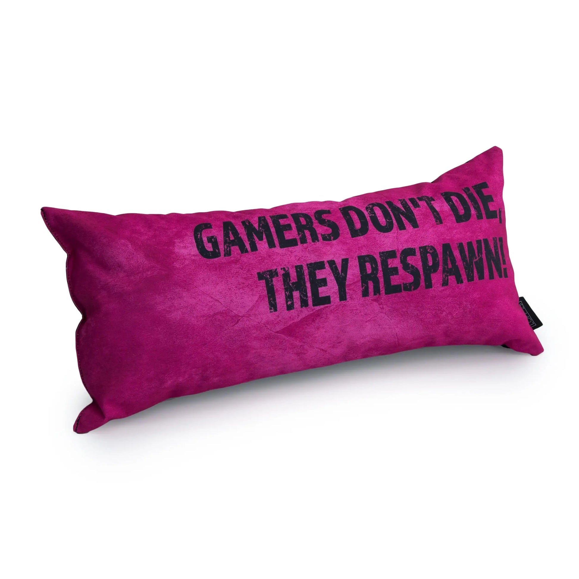A fluffy pink pillow with the text "Gamers Don't Die, They Respawn!" written on it in white letters. 