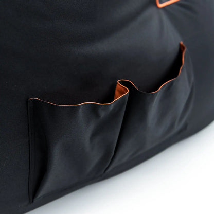  The pocket has a zipper closure and a small orange pull tab.